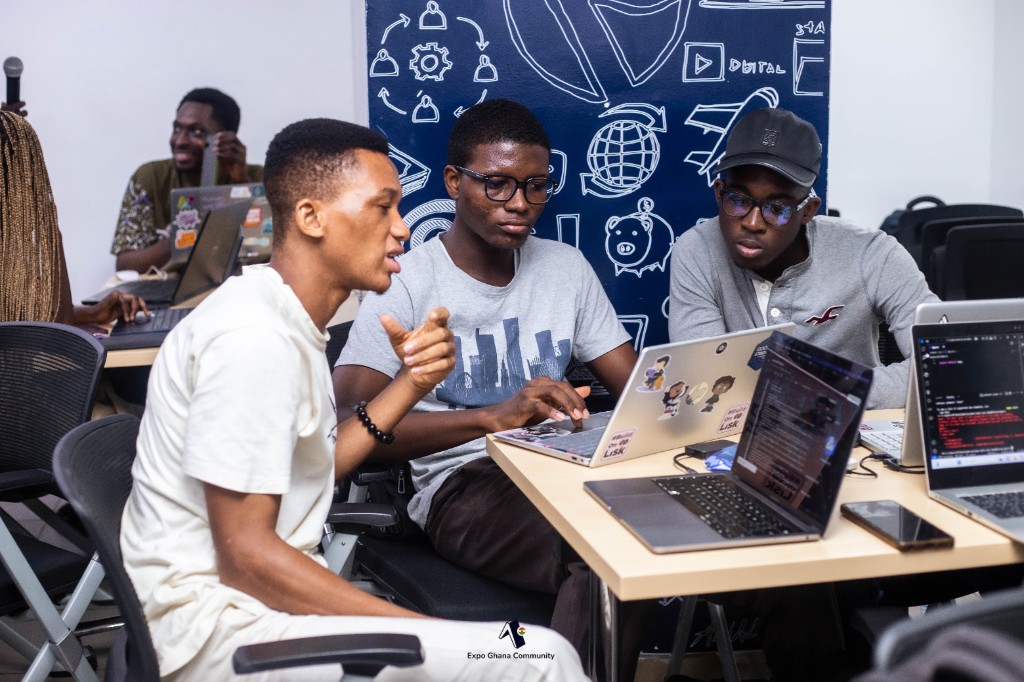 Community members pairing on a project at an Expo Ghana build session